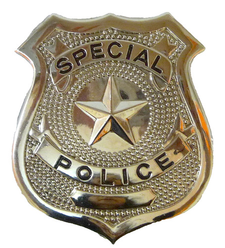 Shiny silver police badge - shiny,